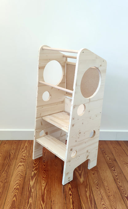 Adjustable Montessori-inspired learning tower with removable board